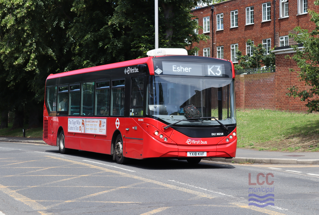 The bus is a red single decker. It is on the K3 to Esher.