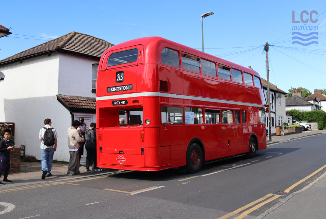 FRM1 is a red double decker bus. It has a single front entrance and the engine is at the rear, a reversal of the traditional Routemaster. This view of the back of the bus showing its rear engine compartment.
