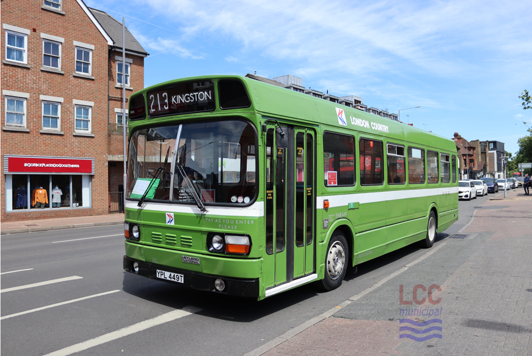 SNB449 is a single deck Leyland National London Country bus. It carries an apple green livery with a white stripe below the windows. The distinctive "double N" logo of the National Bus Company is visible on the front and side of the bus. It is seen on Kingston's busy one-way traffic system, having just arrived at the Fairfield bus station.