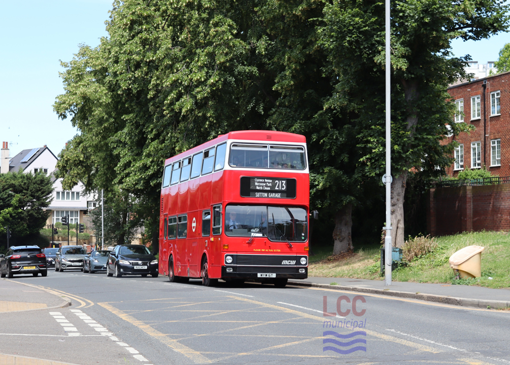 M6 is an early example of a London Transport MCW Metrobus. It is painted in red, although the surrounds of the upper deck window are in white, a brief livery change for new double deckers in the late 1970s. The windscreen has a distinctive dip in it, the right hand pane extending lower than the left hand one.