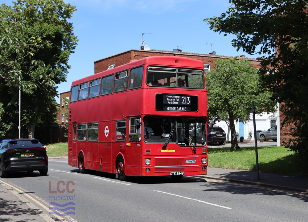 M394 is a alter example of a London Transport Mark 1 MCW Metrobus. It is painted in all over red and carries a large white London Transport Roundel on its side. The windscreen has a distinctive dip in it, the right hand pane extending lower than the left hand one. 